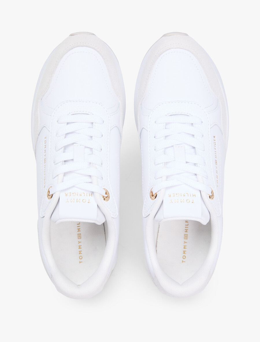 sneaker aus geprägtem th-monogramm-leder