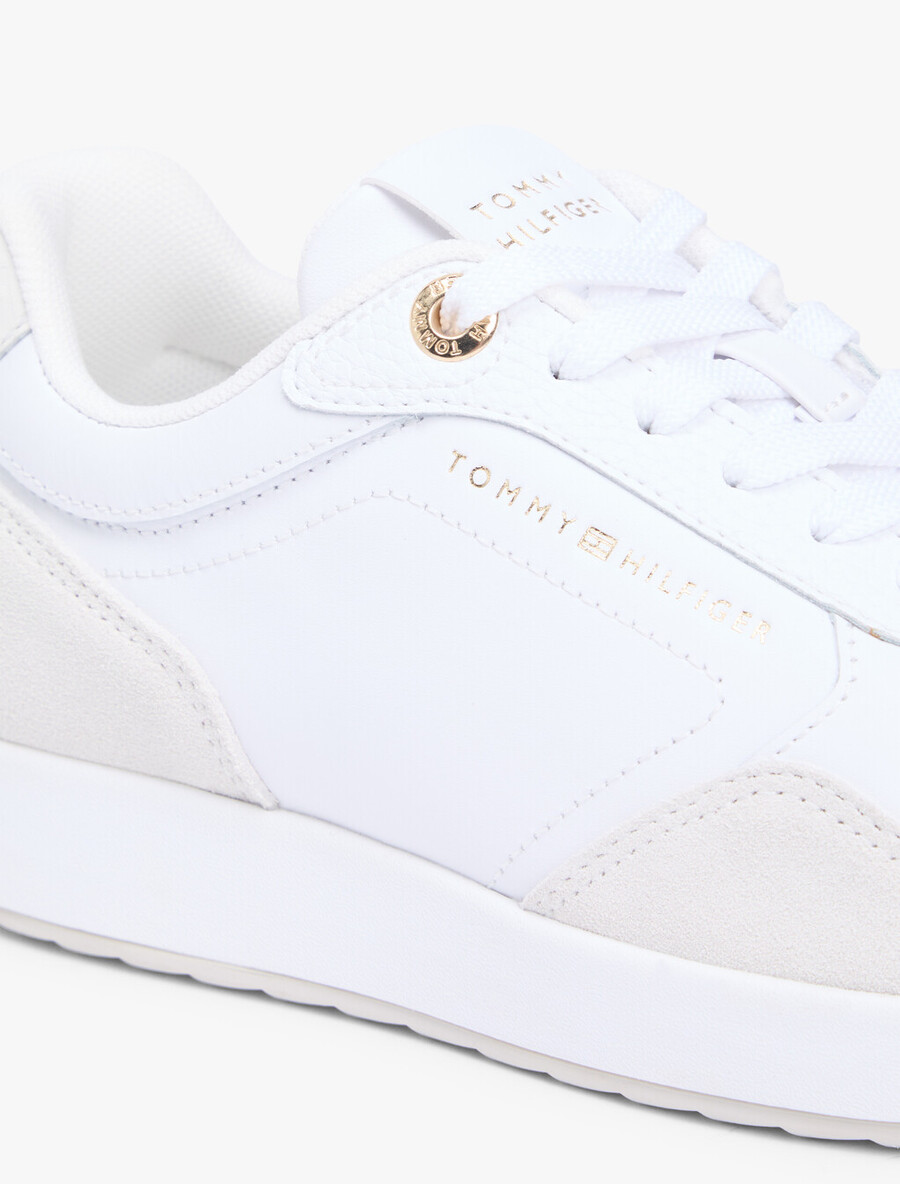 sneaker aus geprägtem th-monogramm-leder